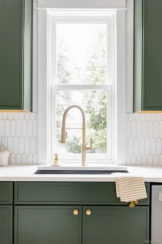 a bathroom with a sink and a window