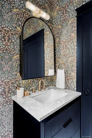 a bathroom with a sink and a mirror