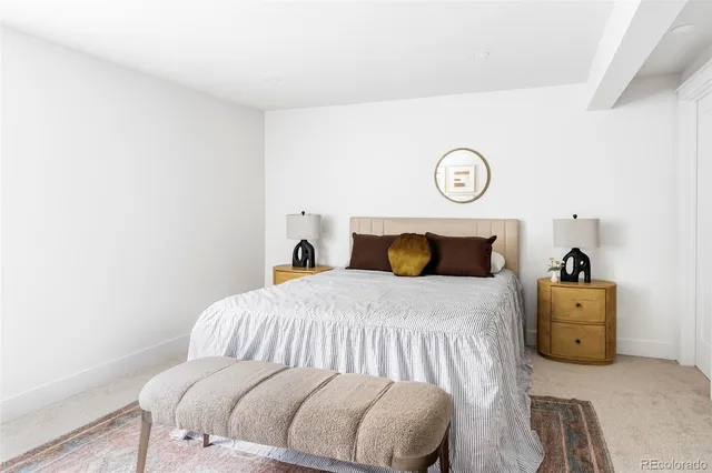 a bedroom with a bed and a closet