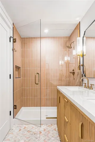 a bathroom with a shower and a sink