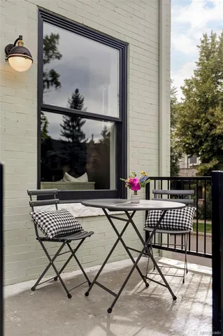 a view of a balcony with chairs