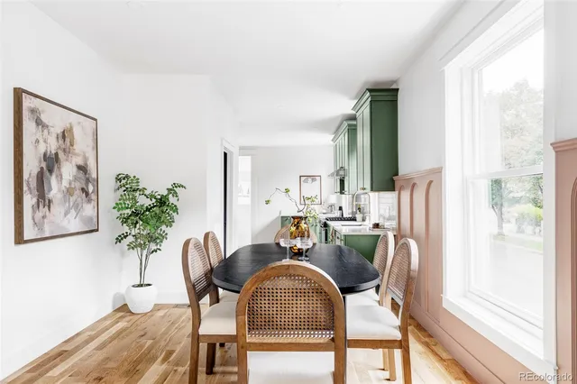 a view of a dining room with furniture window and wooden floor