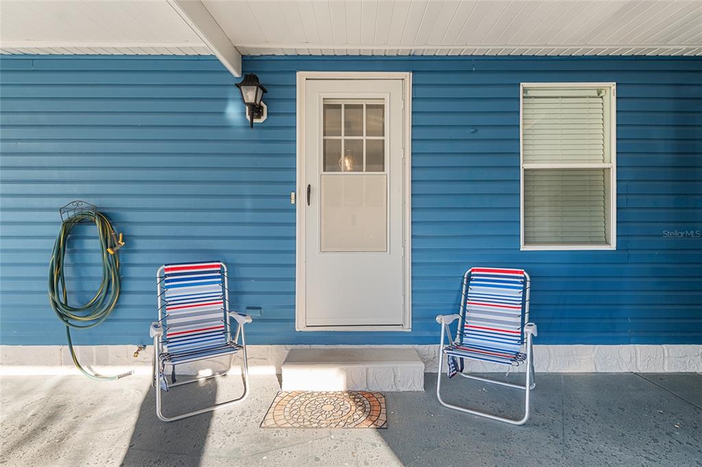6832 Northeast 3rd Place Ocala, FL 34470 - Photo 11 of 70 a backyard of a house with barbeque oven and wooden fence