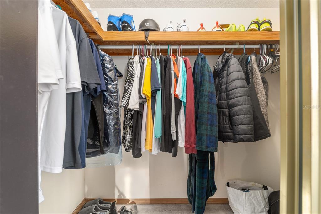 6832 Northeast 3rd Place Ocala, FL 34470 - Photo 35 of 70 a view of walk in closet with clothes and shoes