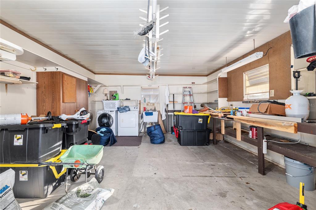 6832 Northeast 3rd Place Ocala, FL 34470 - Photo 46 of 70 a view of a room with lots of furniture and clutter