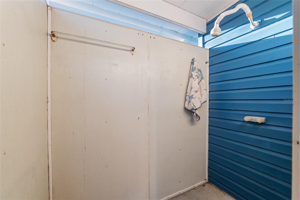 6832 Northeast 3rd Place Ocala, FL 34470 - Photo 50 of 70 a bathroom with a shower and a glass door