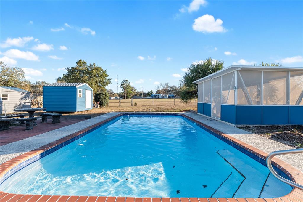 6832 Northeast 3rd Place Ocala, FL 34470 - Photo 51 of 70 a view of a living room and kitchen