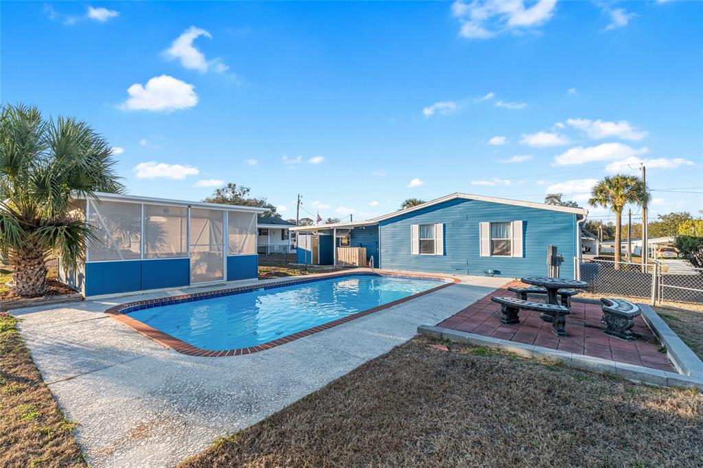 6832 Northeast 3rd Place Ocala, FL 34470 - Photo 53 of 70 a view of a house with swimming pool