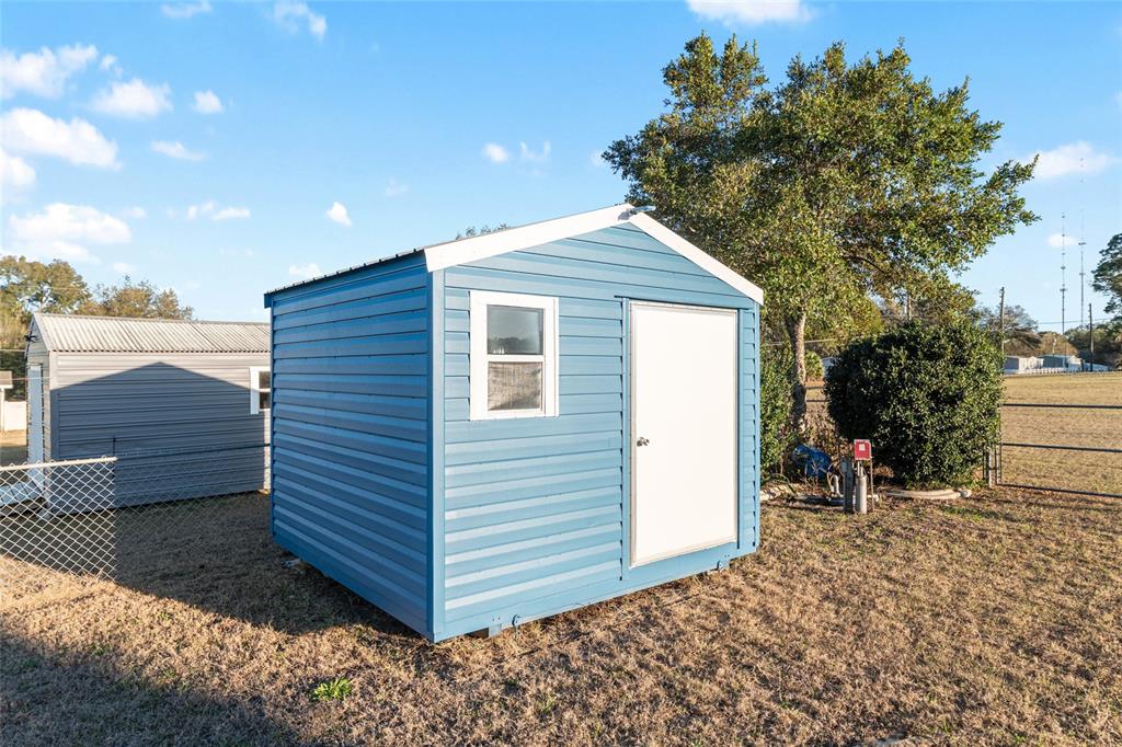 6832 Northeast 3rd Place Ocala, FL 34470 - Photo 55 of 70 a view of a backyard with sitting area