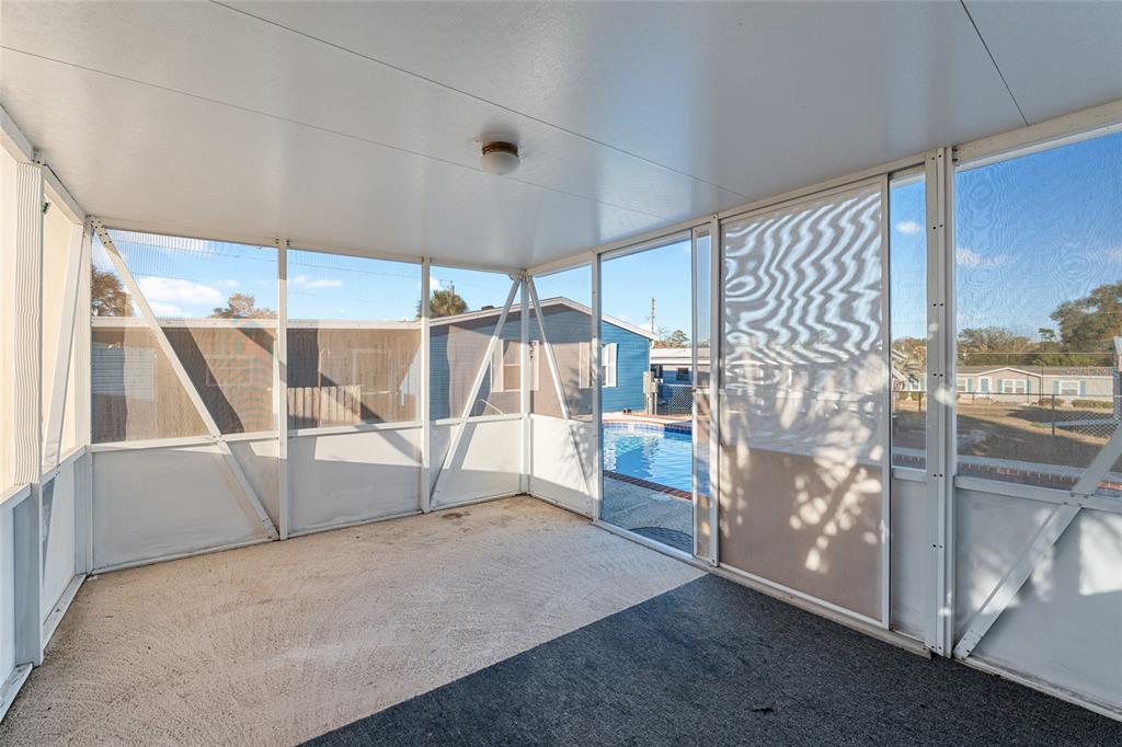 6832 Northeast 3rd Place Ocala, FL 34470 - Photo 59 of 70 a view of a room with racks on the wall