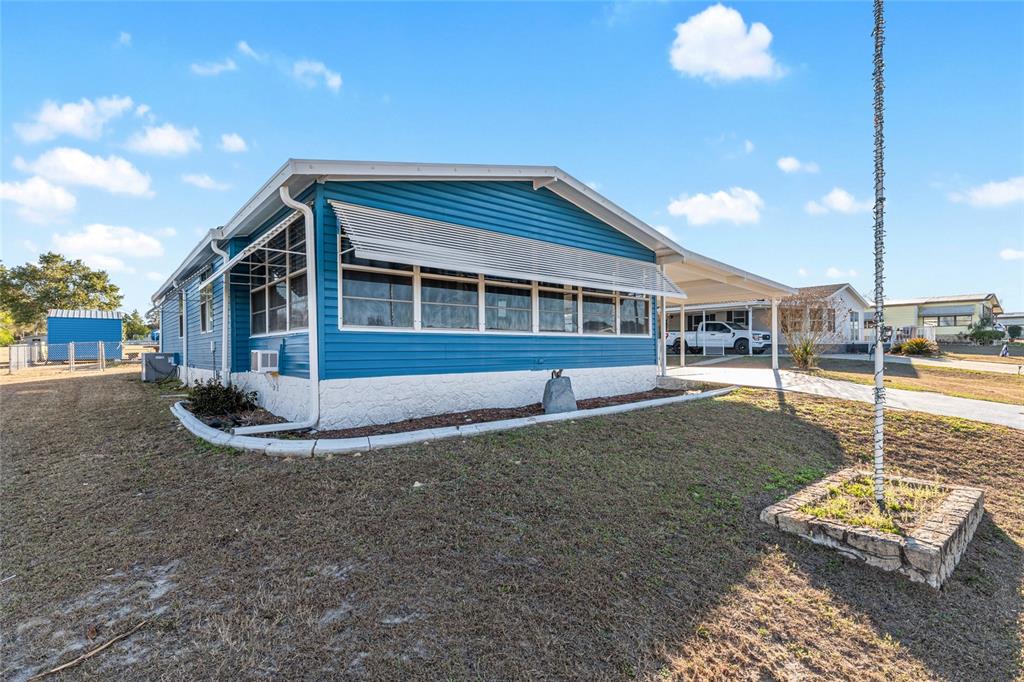 6832 Northeast 3rd Place Ocala, FL 34470 - Photo 6 of 70 a front view of a house with a yard