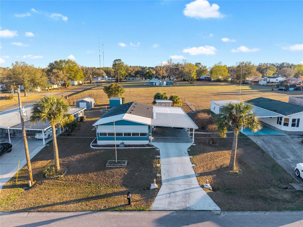 6832 Northeast 3rd Place Ocala, FL 34470 - Photo 63 of 70 a view of a swimming pool and lounge chair