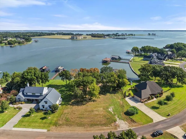 an aerial view of house with yard swimming pool and outdoor seating