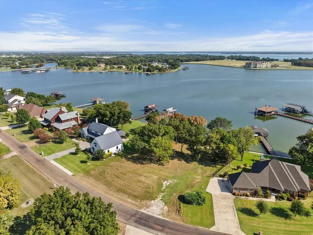 an aerial view of a houses with outdoor space