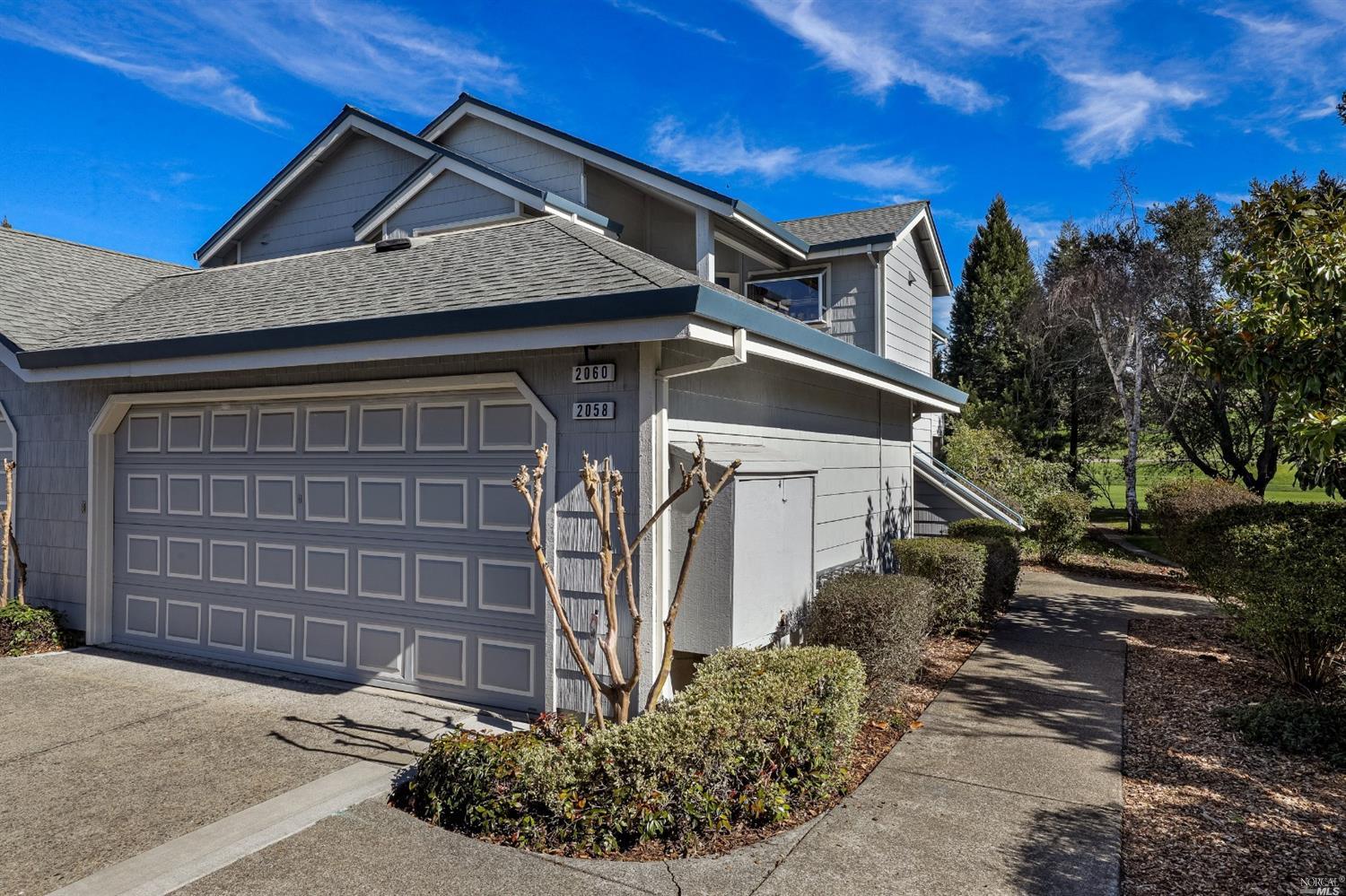 2058 Stonefield Lane Santa Rosa, CA 95403 - Photo 1 of 1 a front view of a house with garden