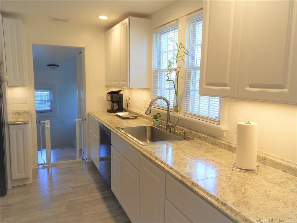 a kitchen with a sink and a window
