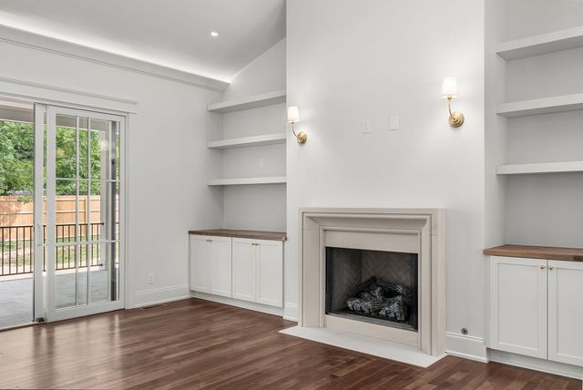 a kitchen with kitchen island a sink stainless steel appliances and cabinets