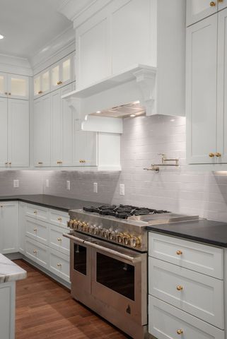 a bath room with a bath tub and a shower