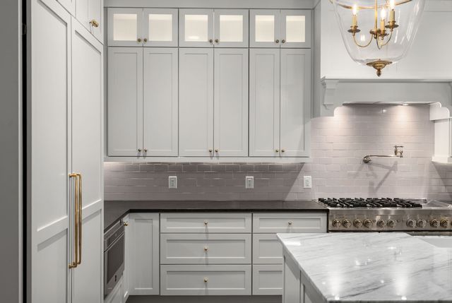 a view of a hallway with wooden floor and closet
