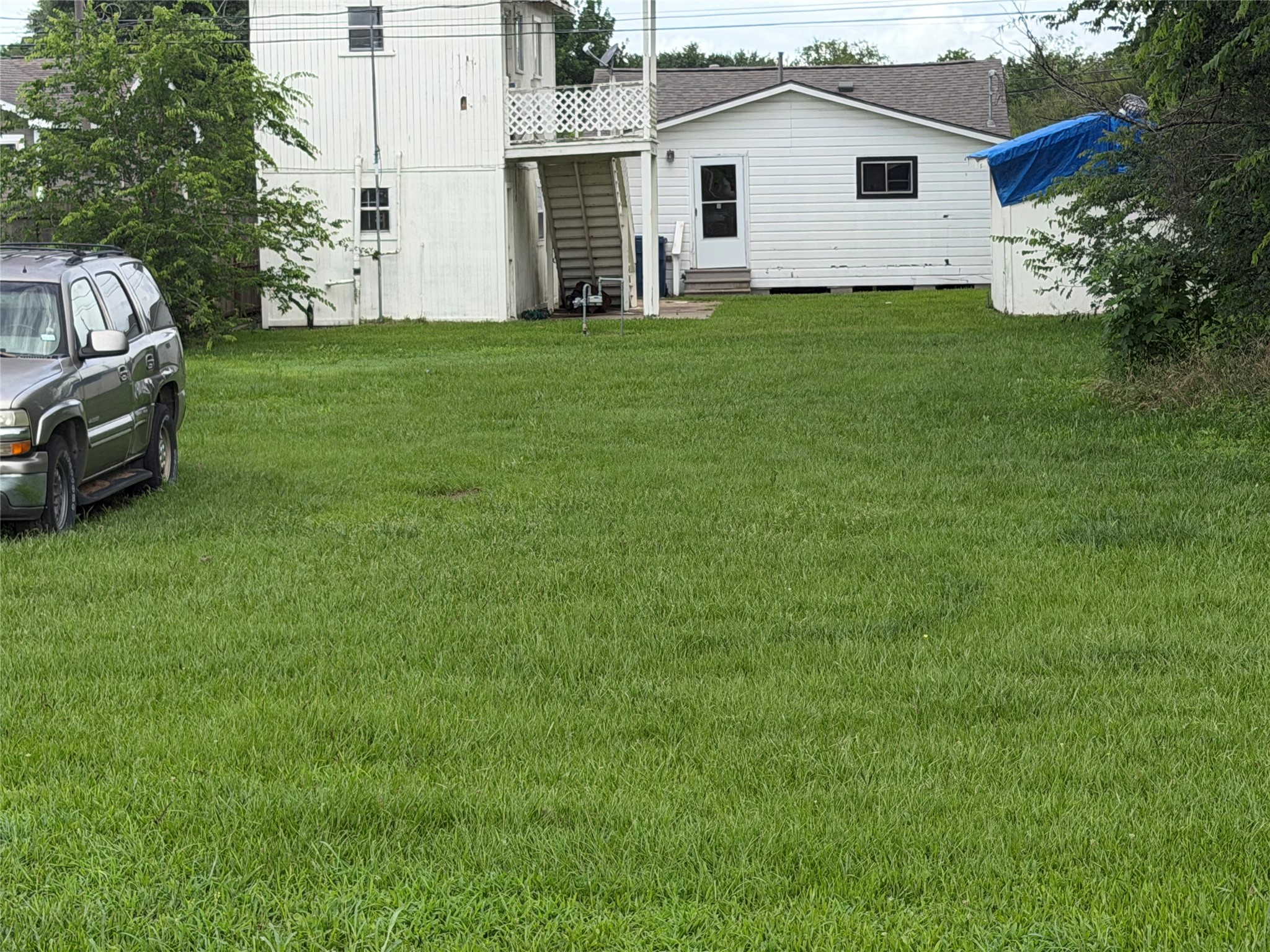 Lot 16 Gin Road Kendleton, TX 77417 - Photo 6 of 8 a view of a house with a backyard