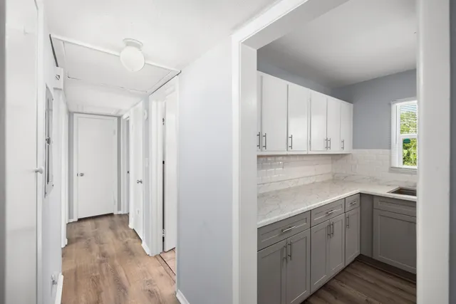 a kitchen with a sink cabinets and window