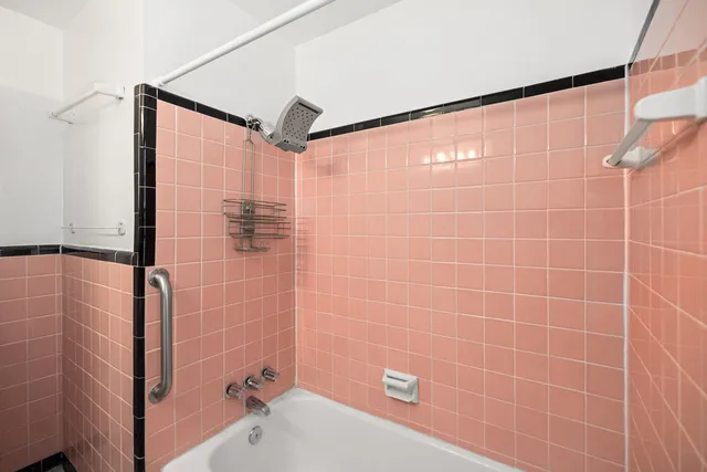 a bathroom with a shower and a bathtub