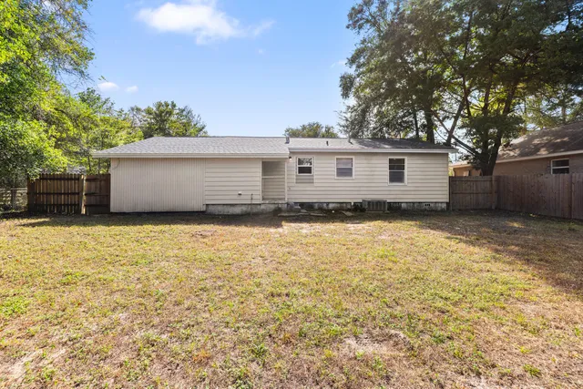 a house view with a backyard space