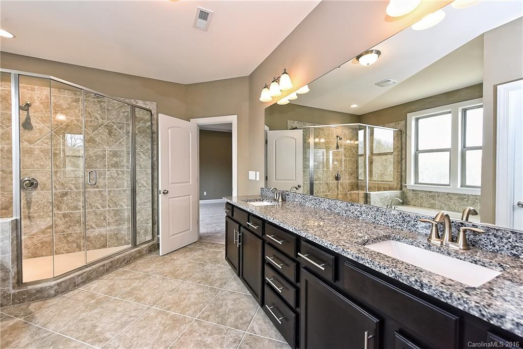 8069 Clems Branch Road Indian Land, SC 29707 - Photo 14 of 24 a bathroom with a granite countertop sink mirror and double