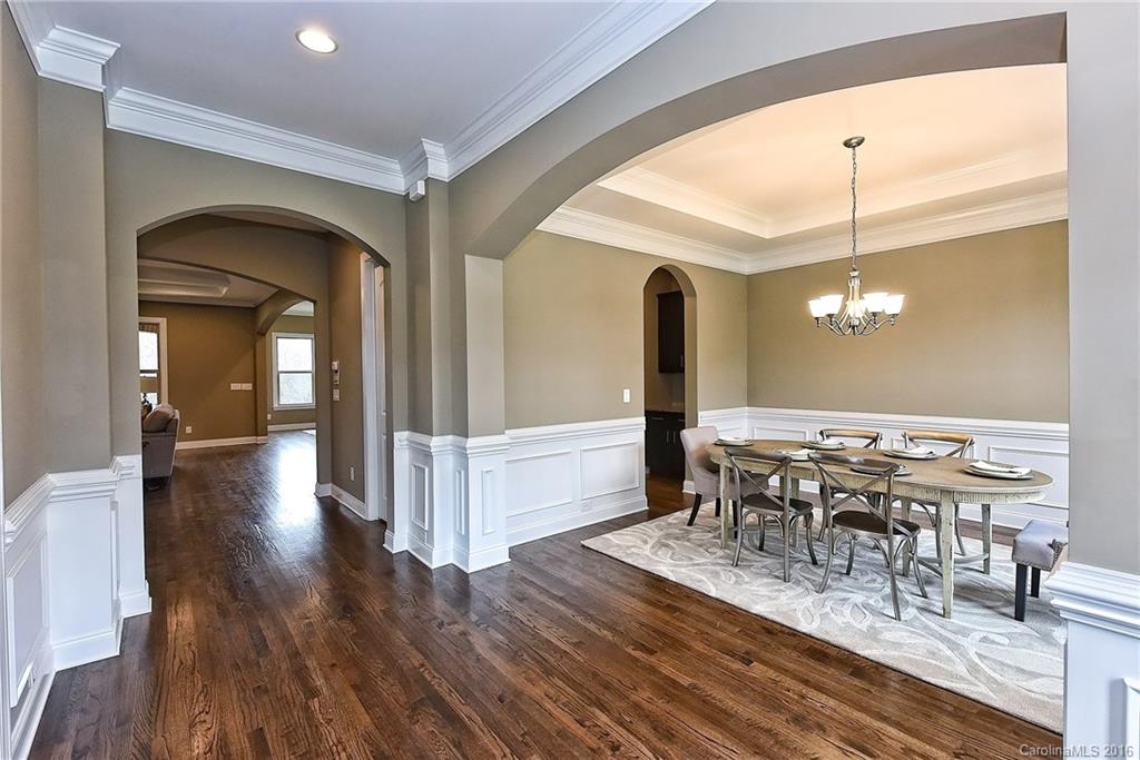 8069 Clems Branch Road Indian Land, SC 29707 - Photo 4 of 24 a view of a dining room with furniture window and wooden floor