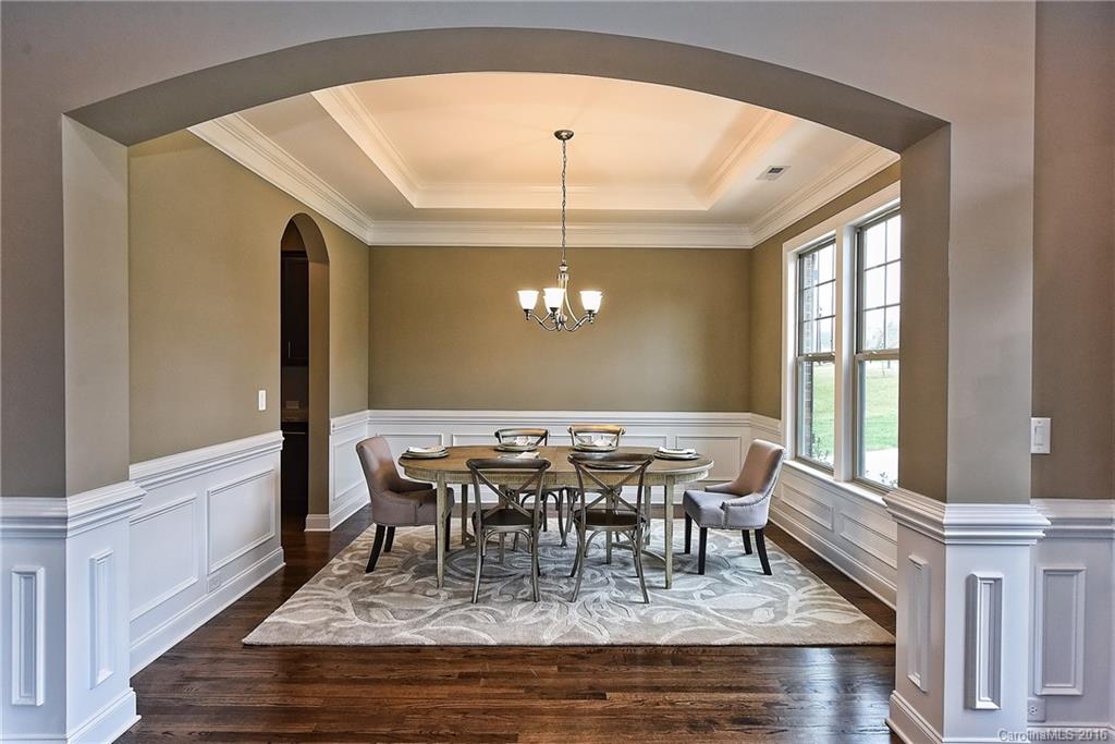 8069 Clems Branch Road Indian Land, SC 29707 - Photo 5 of 24 a view of a dining room with furniture window and wooden floor