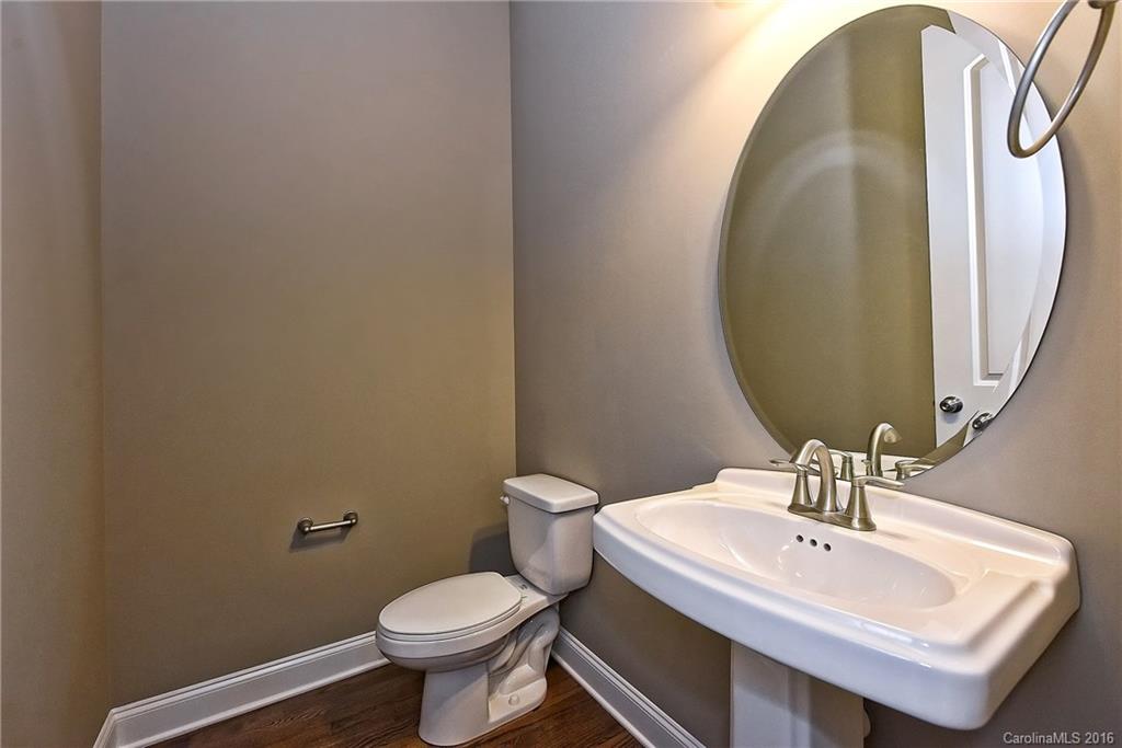 8069 Clems Branch Road Indian Land, SC 29707 - Photo 6 of 24 a bathroom with a toilet sink and mirror