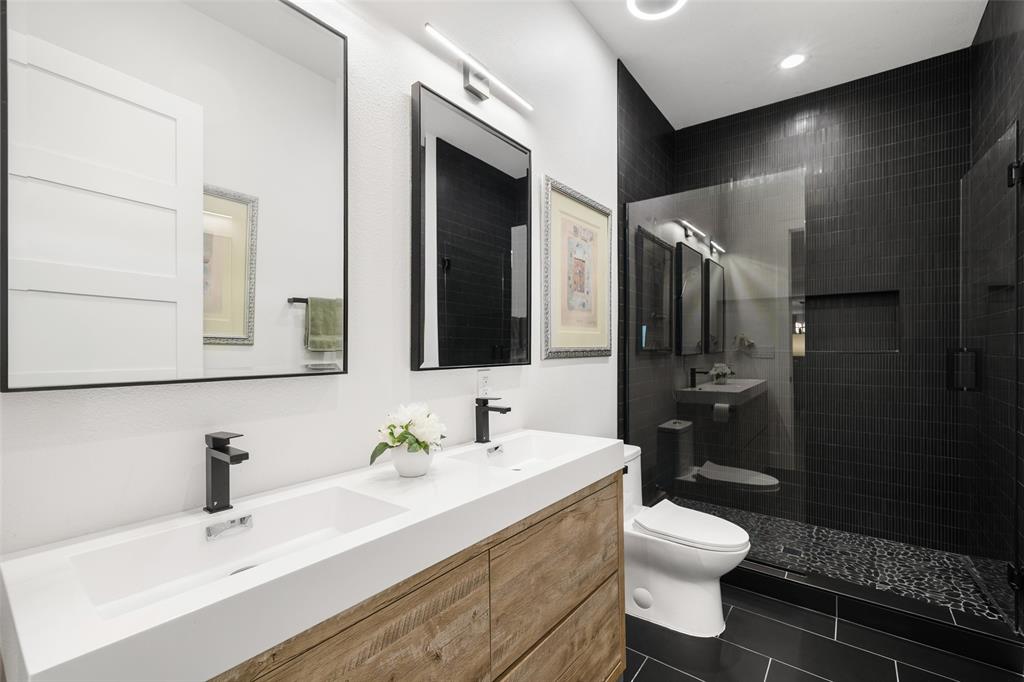 62 Main Street, Unit 200 Colleyville, TX 76034 - Photo 27 of 37 a bathroom with a sink toilet and shower