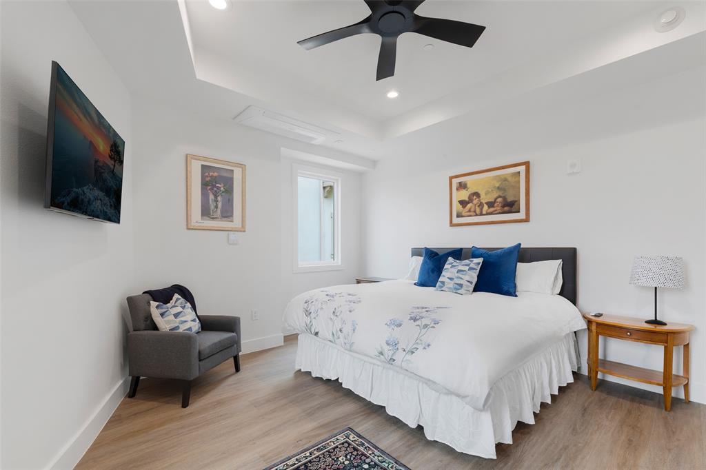 62 Main Street, Unit 200 Colleyville, TX 76034 - Photo 29 of 37 a bedroom with a bed couch and a window