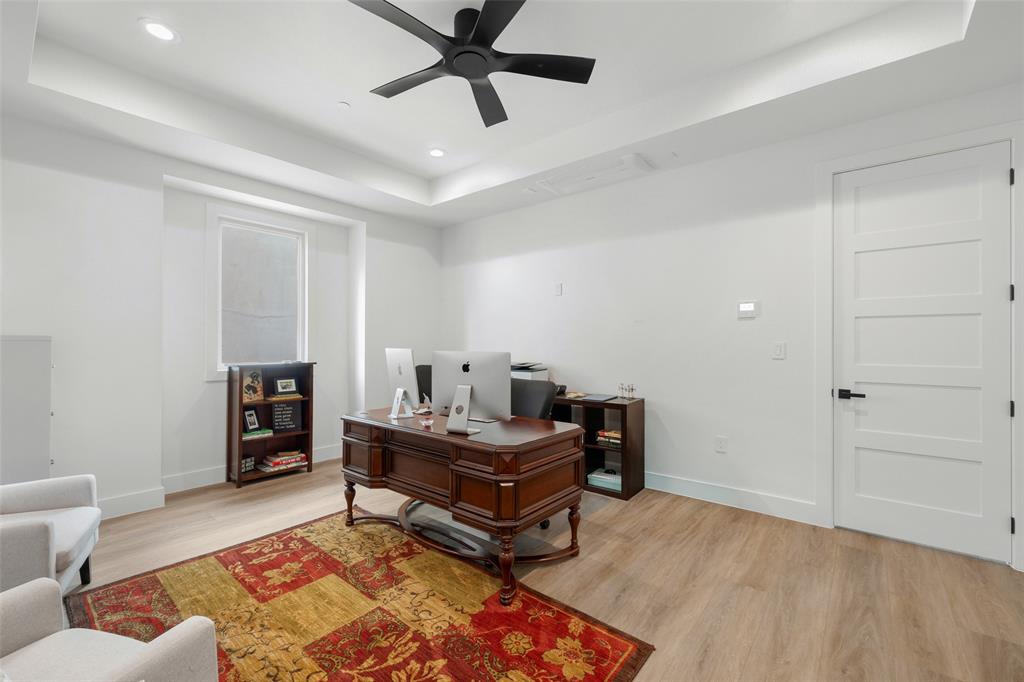 62 Main Street, Unit 200 Colleyville, TX 76034 - Photo 31 of 37 a living room with furniture and a wooden floor