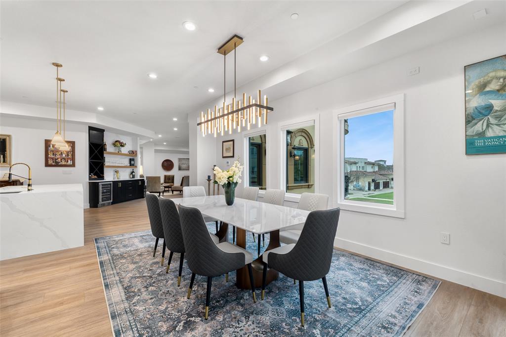 62 Main Street, Unit 200 Colleyville, TX 76034 - Photo 9 of 37 a dining room with wooden floor a glass table and chairs