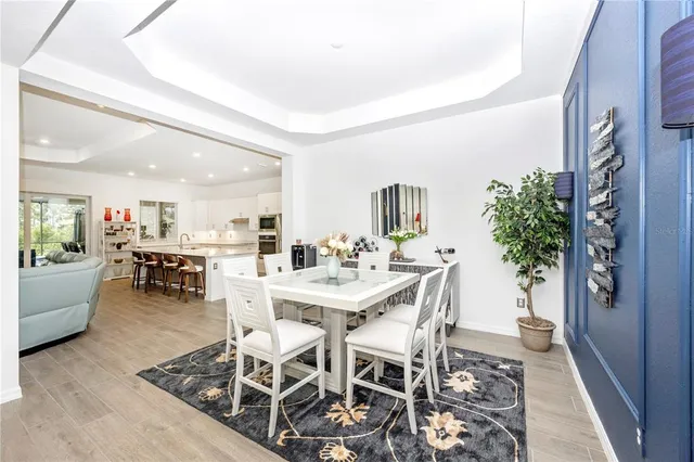 a large bed sitting in a bedroom next to a window