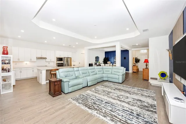 a bedroom with a bed and a chair in it