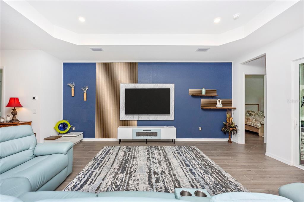 12845 Tulum Loop Venice, FL 34293 - Photo 20 of 100 a living room with furniture and a flat screen tv
