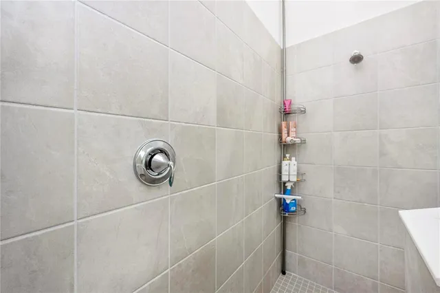 a view of a swimming pool with a table and chairs under an umbrella