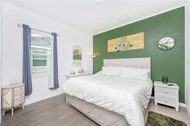 a view of outdoor kitchen with a table and chairs under an umbrella