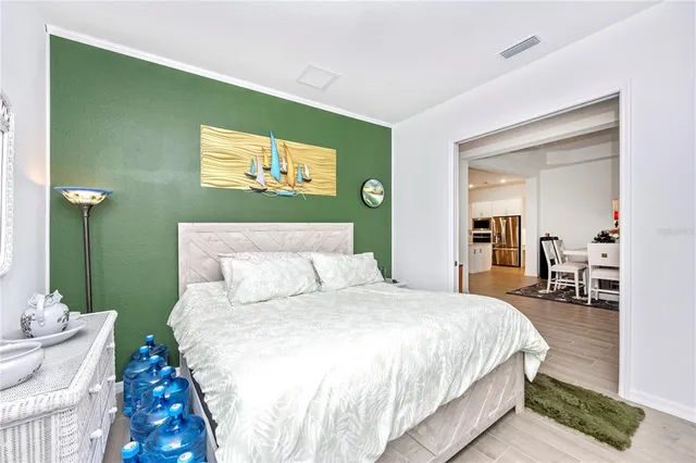 a view of a patio with a table and chairs under an umbrella