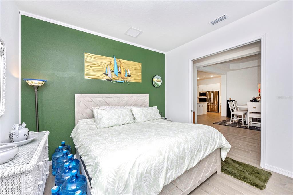 12845 Tulum Loop Venice, FL 34293 - Photo 31 of 100 a bedroom with a bed and a table