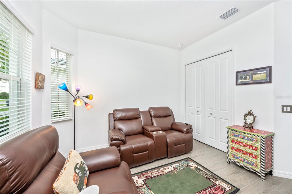 12845 Tulum Loop Venice, FL 34293 - Photo 34 of 100 a living room with furniture and a window