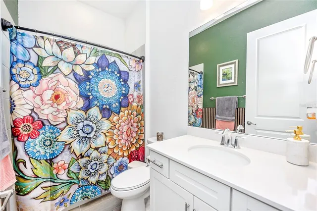 a view of a swimming pool with a lawn chairs under an umbrella