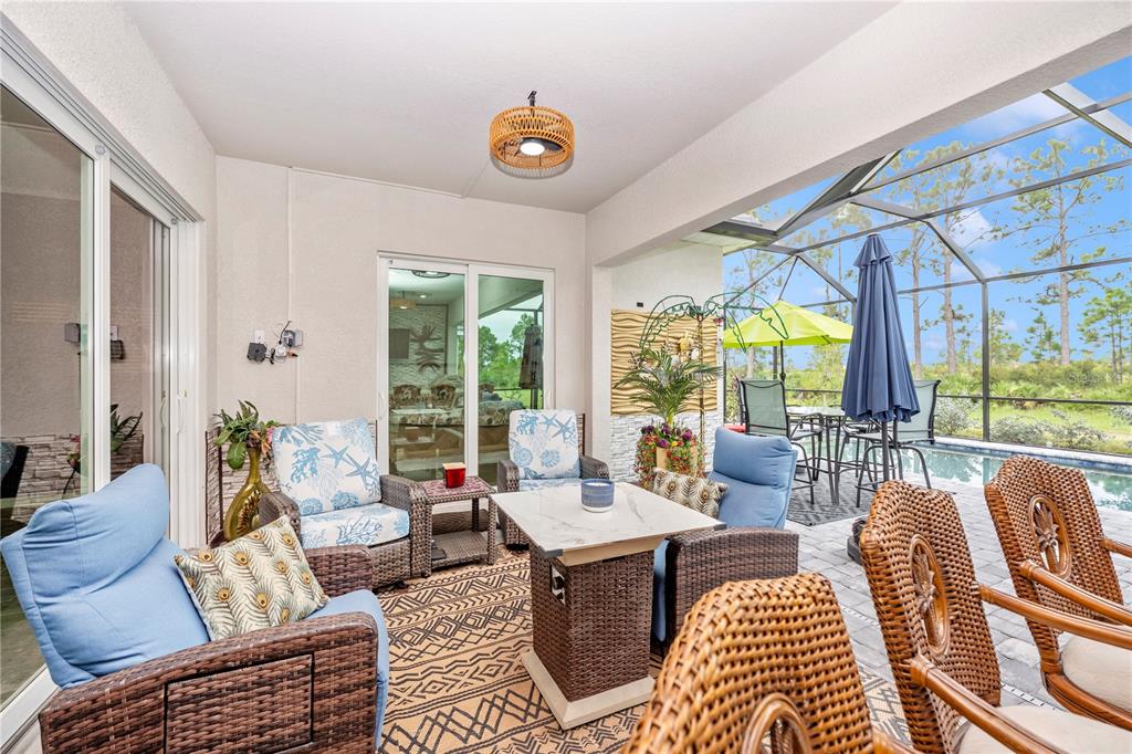 12845 Tulum Loop Venice, FL 34293 - Photo 39 of 100 a living room with furniture and a large window