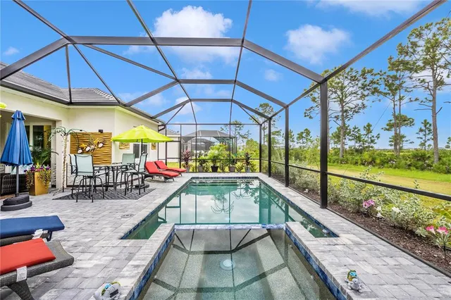 a view of a room with gym equipment and a large window