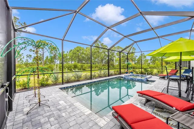 a view of a house with backyard porch and sitting area