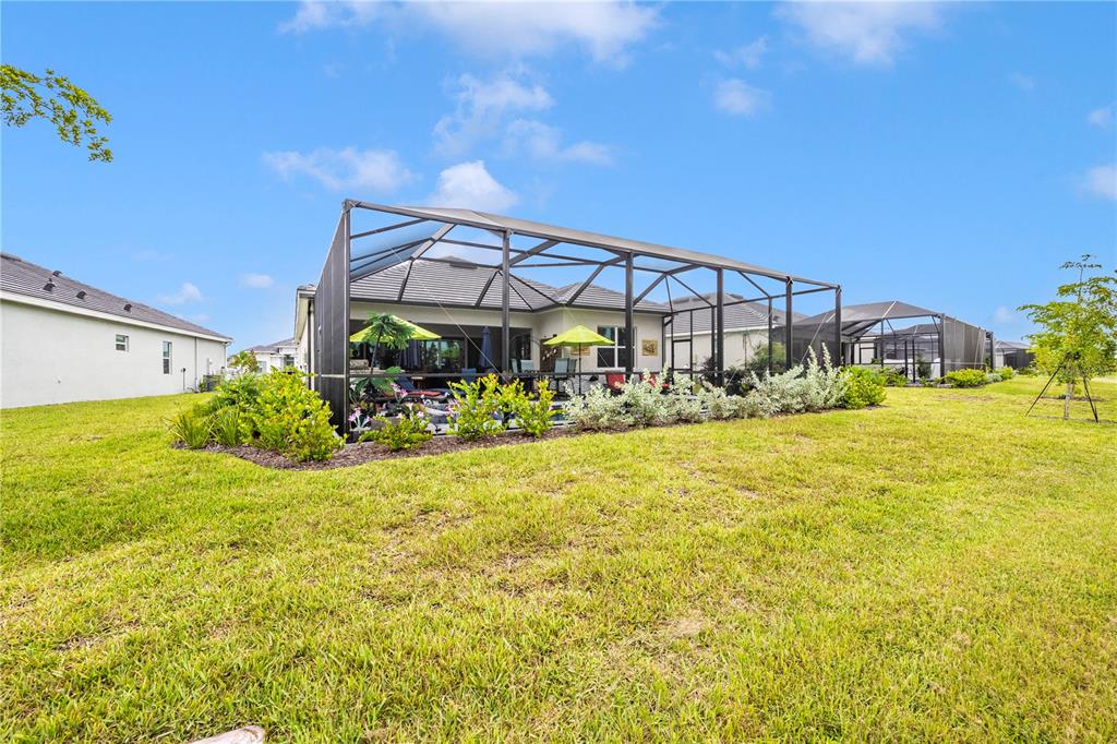 12845 Tulum Loop Venice, FL 34293 - Photo 52 of 100 a view of a house with a yard
