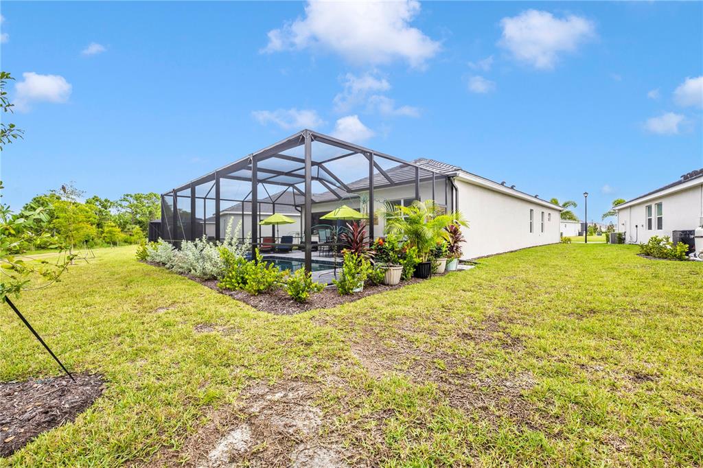 12845 Tulum Loop Venice, FL 34293 - Photo 54 of 100 a view of a house with a yard