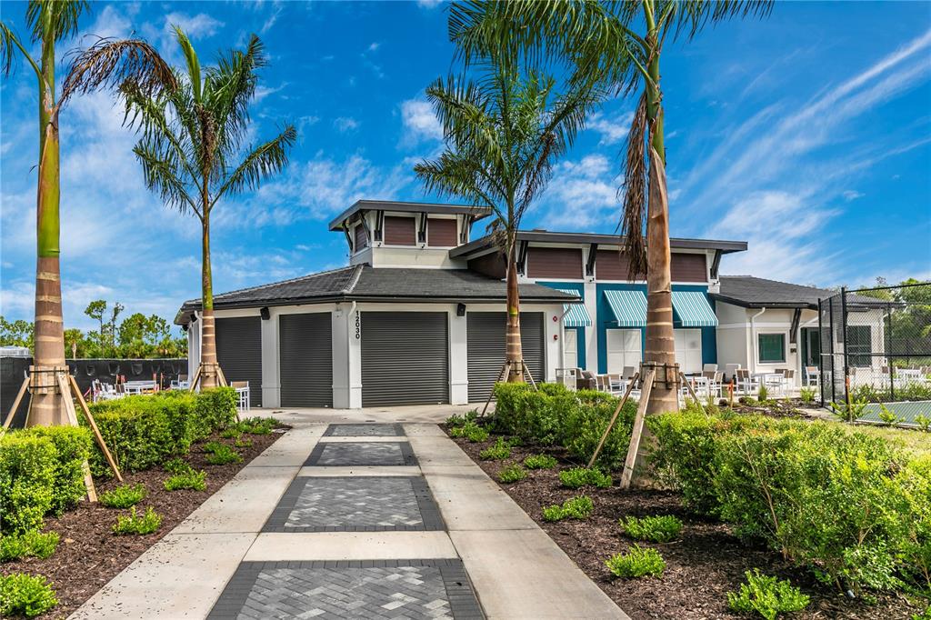 12845 Tulum Loop Venice, FL 34293 - Photo 62 of 100 a front view of a house with a garden